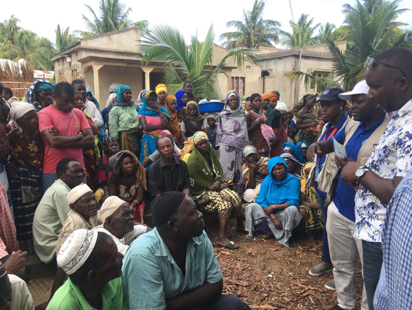 Displaced people gather for a food distribution in Mocímboa da Praia, Cabo Delgado, where a once shadowy insurgent group is seeking to broaden its appeal among local residents