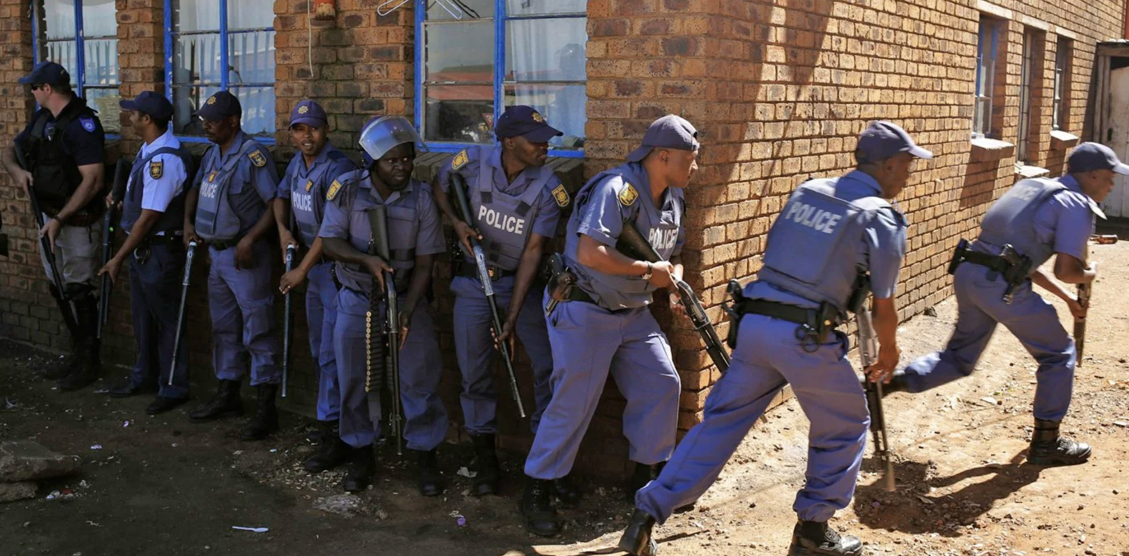 South African Police enforce a perimeter around a crime scene&nbsp;in Soweto on July 10.