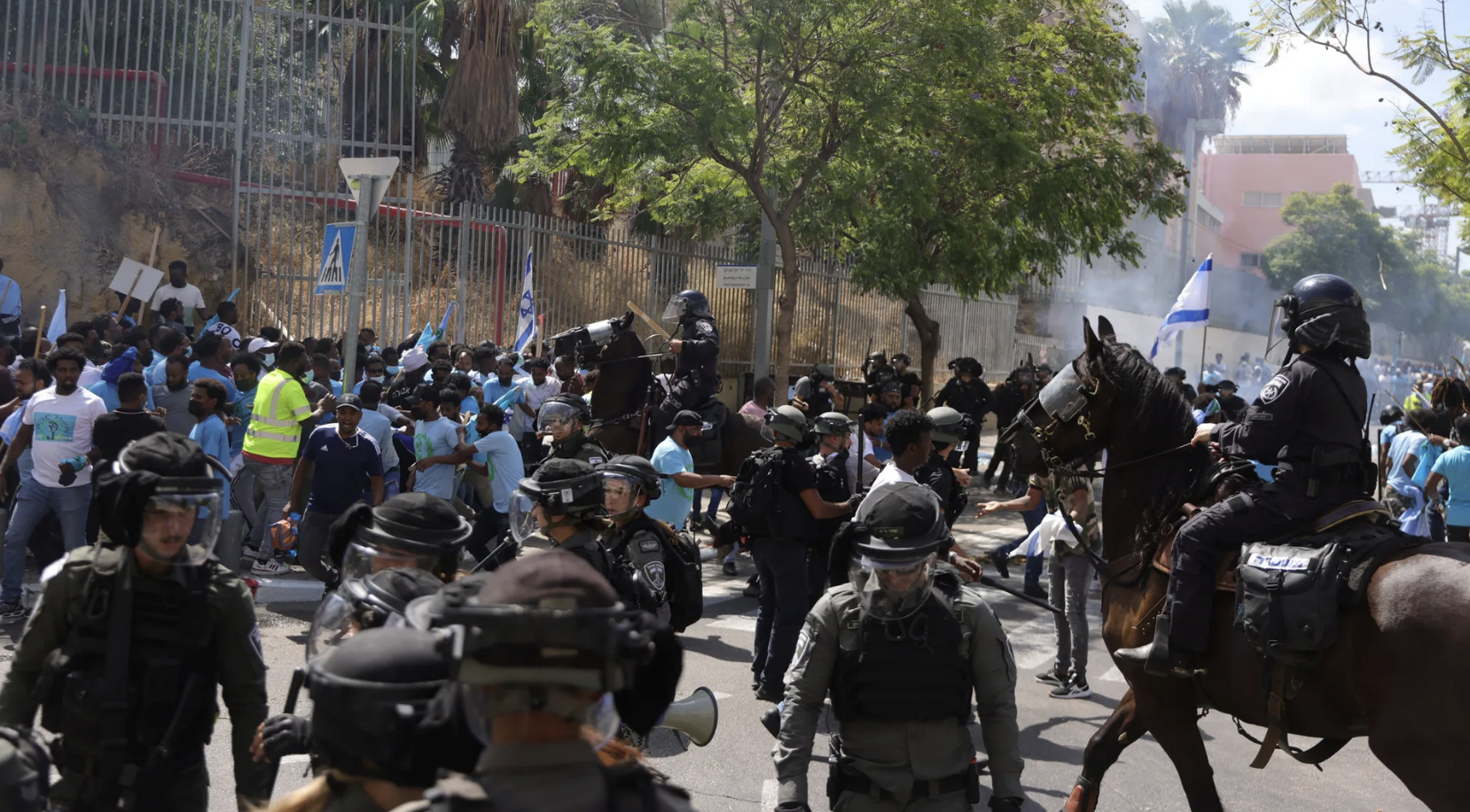 Police clash with asylum seekers at a protest near the Eritrean embassy in Tel Aviv on Saturday.