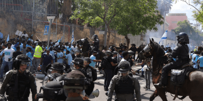 Police clash with asylum seekers at a protest near the Eritrean embassy in Tel Aviv