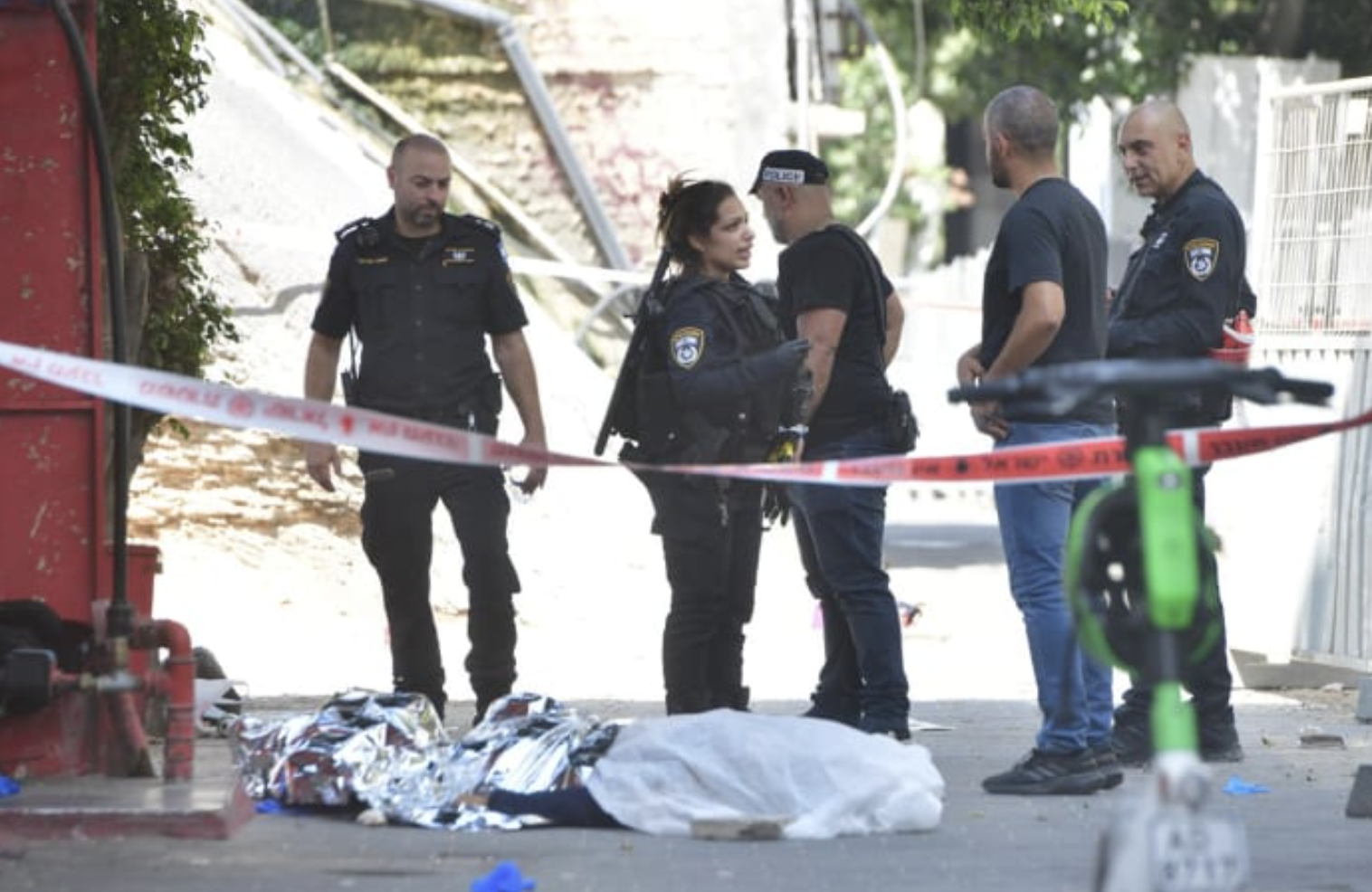  Police officers at the scene of the brawl that left two Eritrean nationals dead in Tel Aviv. August 24, 2024. (photo credit: AVSHALOM SASSONI)
