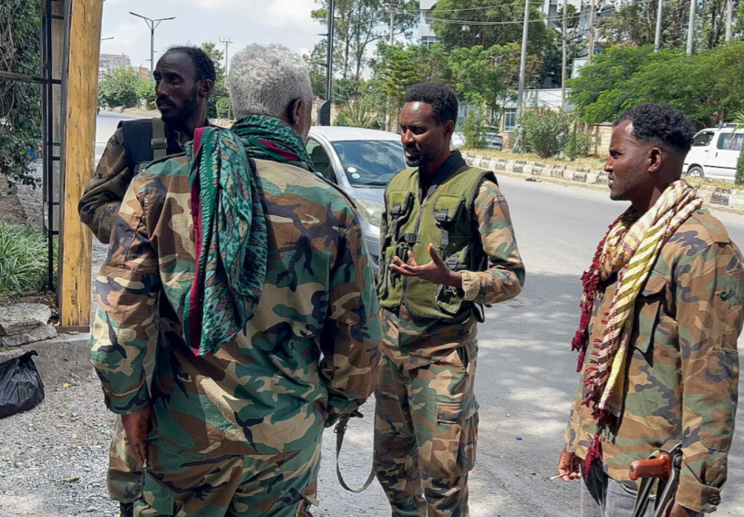 Members of the Ethiopian pro-government Tigray Peace Force (TPF) patrol after the Tigray People's Liberation Front (TPLF) army retreated from the regional capital Mekelle